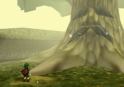 Image shows young Link looking at the Great Deku Tree
